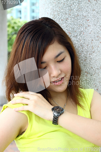 Image of Asian woman smiling outdoor