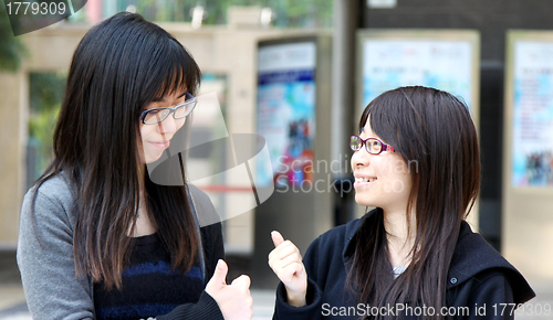 Image of Asian woman with thumb up