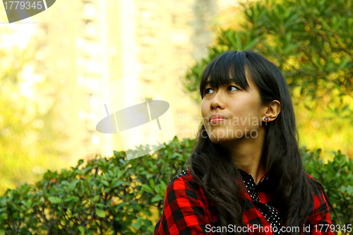 Image of Asian woman thinking