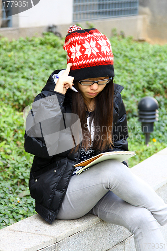 Image of Asian woman thinking 