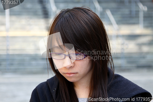 Image of Asian sad woman