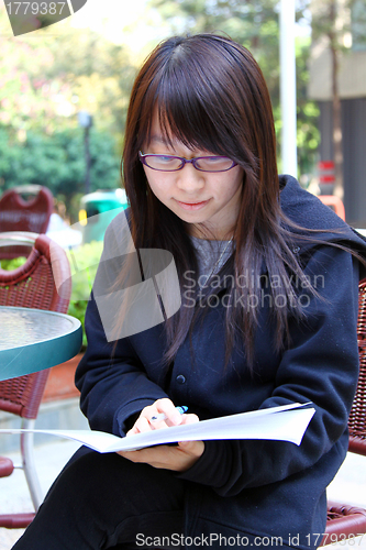 Image of Asian girl studying in university