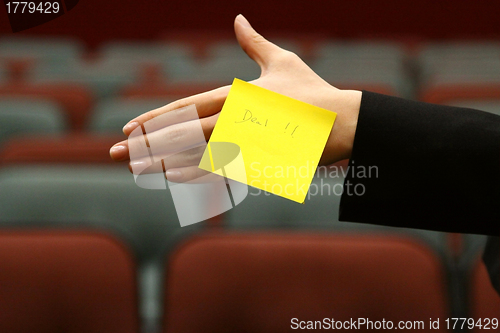 Image of Asian woman giving a handshake