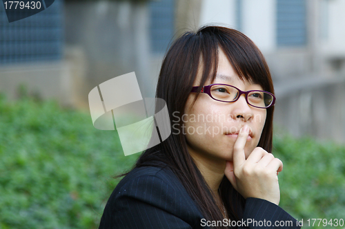 Image of Asian businesswoman thinking