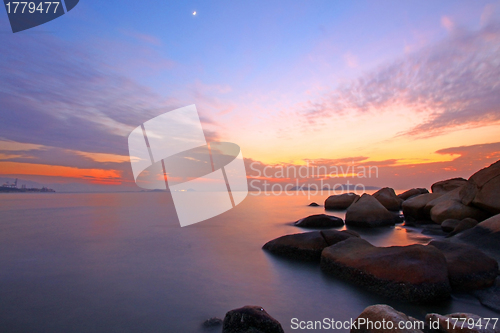 Image of Sunset over the ocean. Nature composition under long exposure.