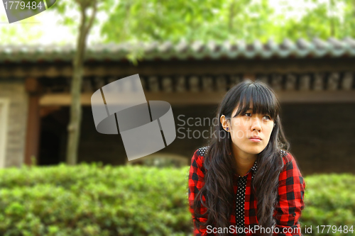 Image of Asian woman thinking