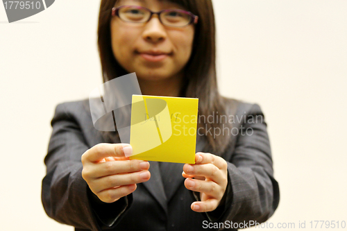 Image of Businesswoman with deal memo paper on hands