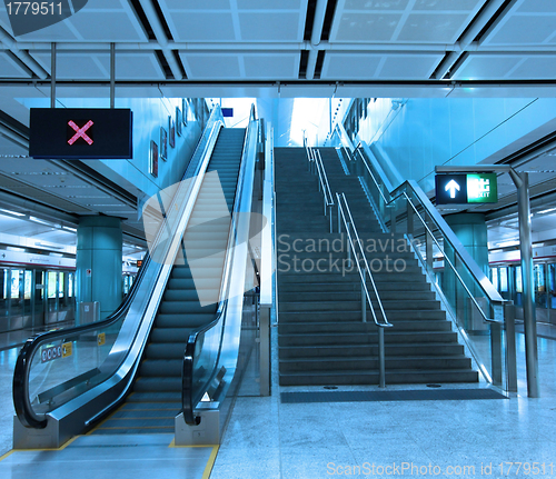 Image of Moving escalator in train station