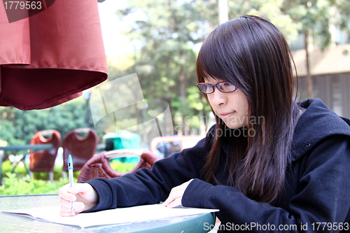 Image of Asian girl studying in university