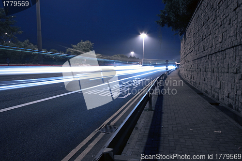 Image of Modern city with night traffic