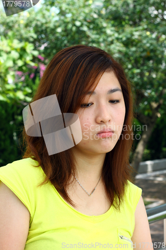 Image of Asian woman with sad face