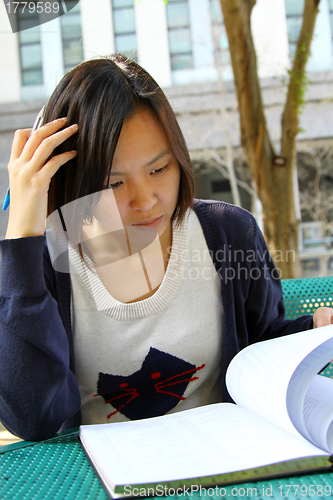 Image of Asian girl studying in university