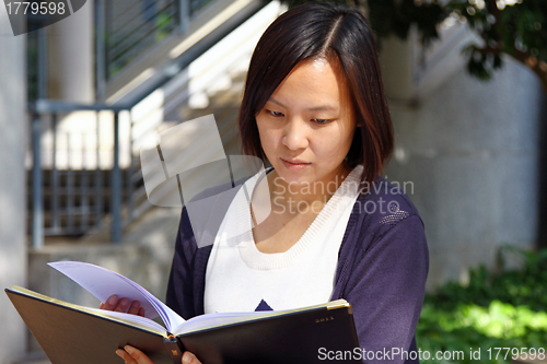 Image of Asian girl studying in university