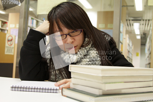 Image of Asian university student in library