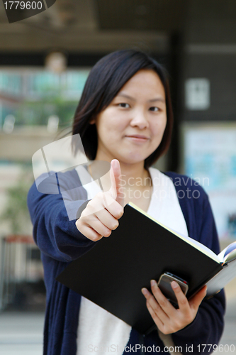 Image of Asian woman thumbs up