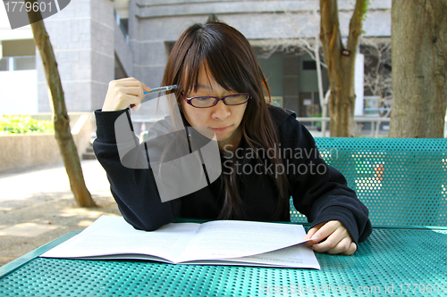 Image of Asian girl studying in university