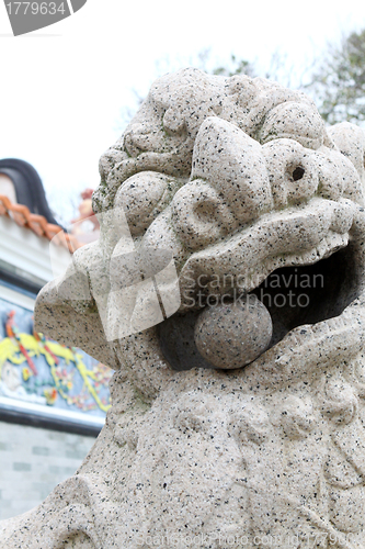 Image of Lion statue outside temple in Hong Kong