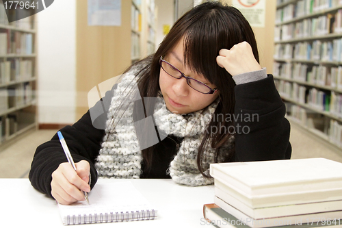 Image of Asian girl studying in university