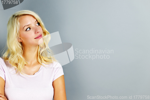 Image of Young woman looking up