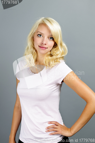 Image of Young blonde woman standing