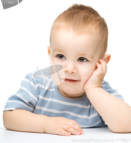Image of Portrait of a cute and pensive little boy