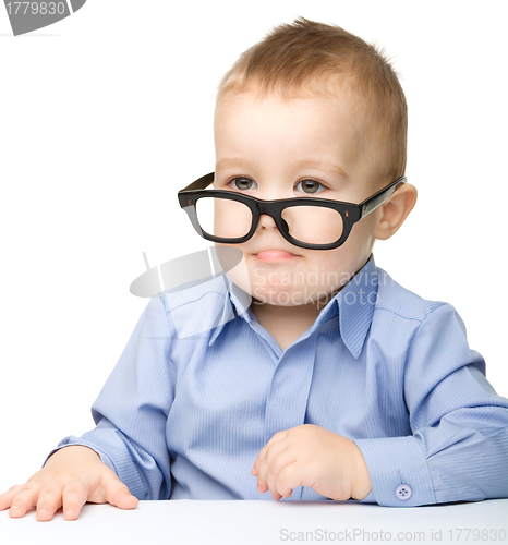 Image of Portrait of a cute little boy wearing glasses