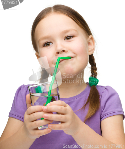 Image of Cute little girl with a glass of pure water