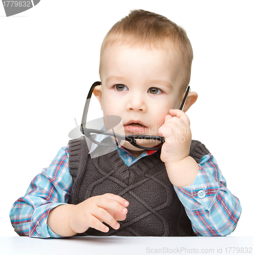 Image of Portrait of a cute little boy wearing glasses