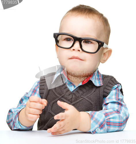 Image of Portrait of a cute little boy wearing glasses