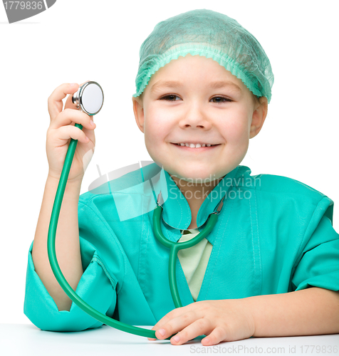 Image of Cute little girl is playing doctor