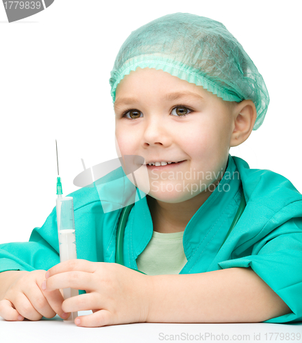 Image of Cute little girl is playing doctor with syringe