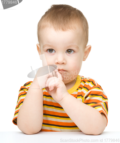 Image of Portrait of a cute little boy looking at something