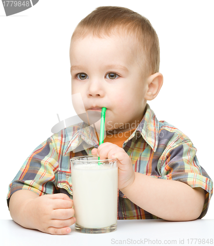 Image of Cute little boy with a glass of milk