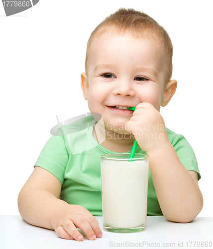 Image of Cute little boy with a glass of milk