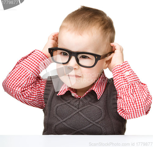 Image of Portrait of a cute little boy wearing glasses