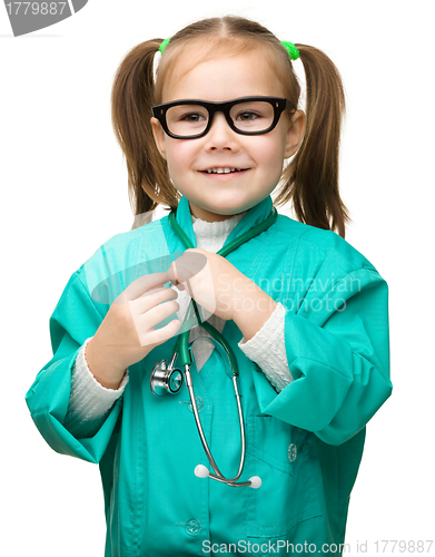 Image of Cute little girl is playing doctor