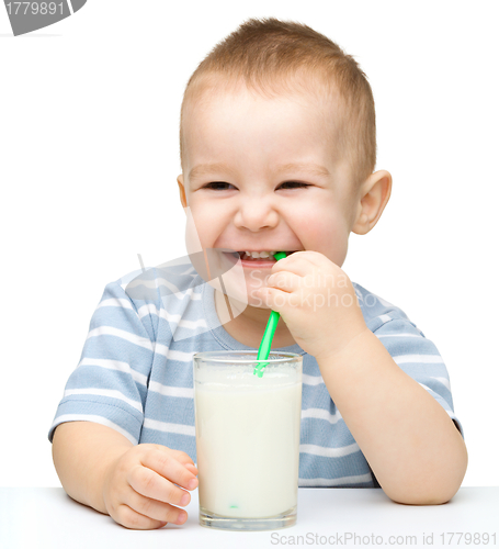 Image of Cute little boy with a glass of milk