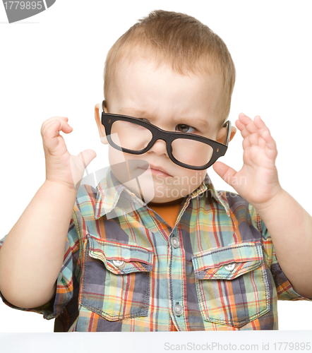 Image of Portrait of a cute little boy wearing glasses