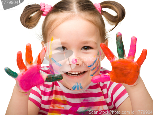 Image of Portrait of a cute girl with painted hands