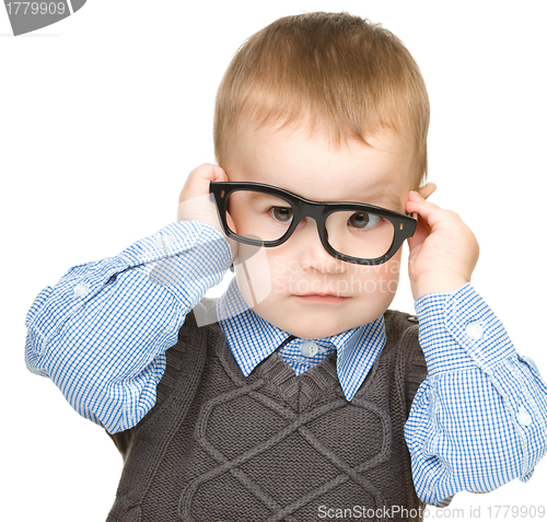 Image of Portrait of a cute little boy wearing glasses