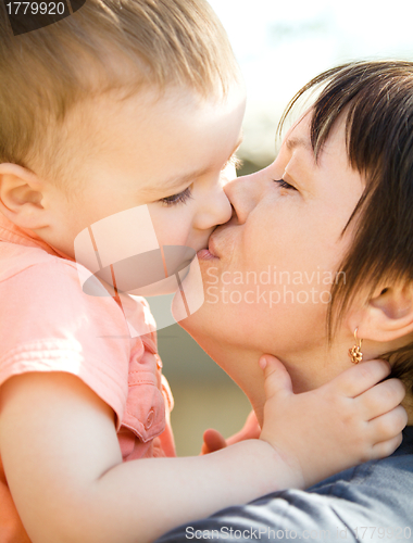 Image of Portrait of a happy mother with her son