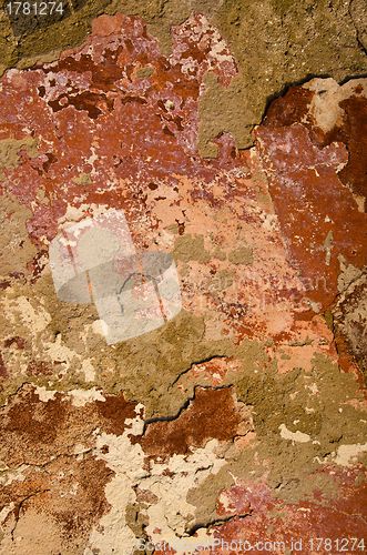 Image of Old painted wall loosing paint.