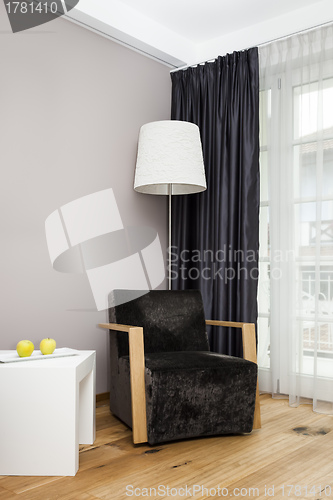 Image of room with lamp and chair