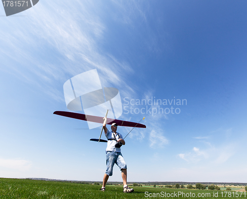 Image of Man launches into the sky RC glider