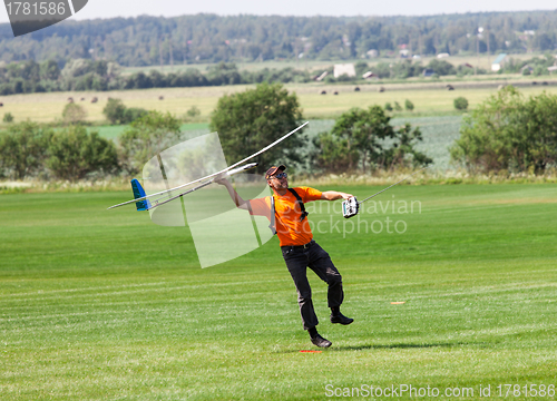 Image of Man launches into the sky RC glider