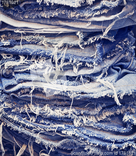 Image of Torn jeans in stack