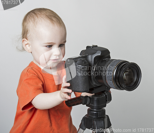 Image of young child with digital camera