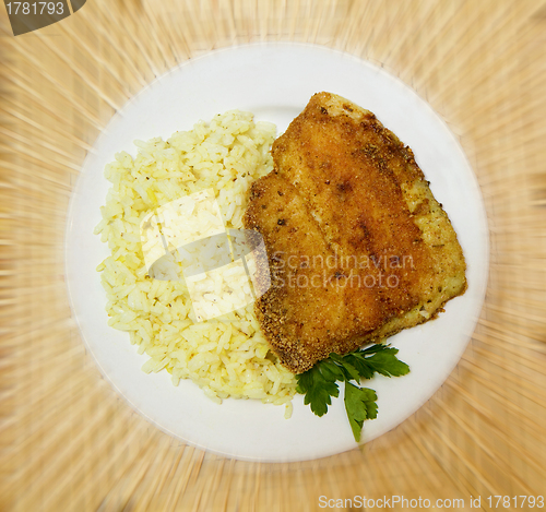 Image of fried tilapia with rice garnish