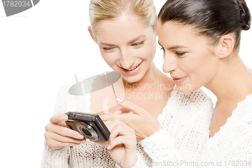 Image of two young women watching pictures