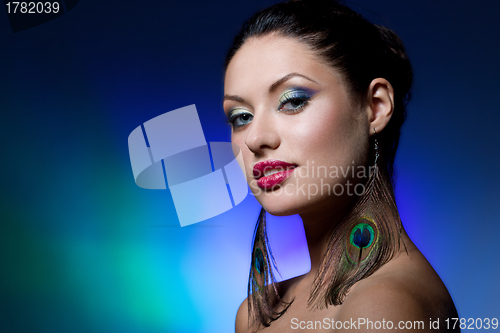 Image of young brunette with creative makeup